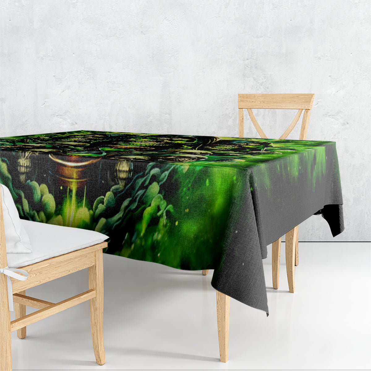 Skull flame tablecloth draping over table legs, green and black graphic print
