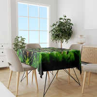 Green and black skull tablecloth with hourglass centerpiece graphic
