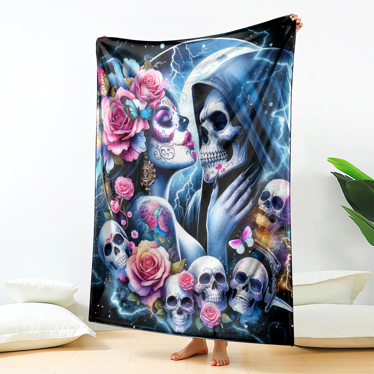 Skull couple throw blanket featuring hooded faces, skulls, roses, butterflies and blue lightning