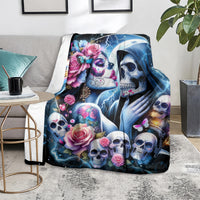 Skull couple blanket on floor, blue lightning design with roses and skull face artwork