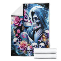 Skull couple blanket, folded view with blue lightning, roses and skull faces graphic