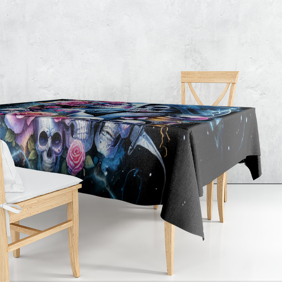 Black skull and rose tablecloth draped over a rectangular table