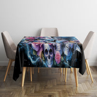 Black skull and rose tablecloth on a dining table with four chairs