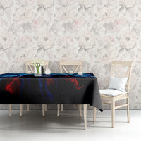 Black tablecloth featuring a blue lightning skull graphic on a dining table.