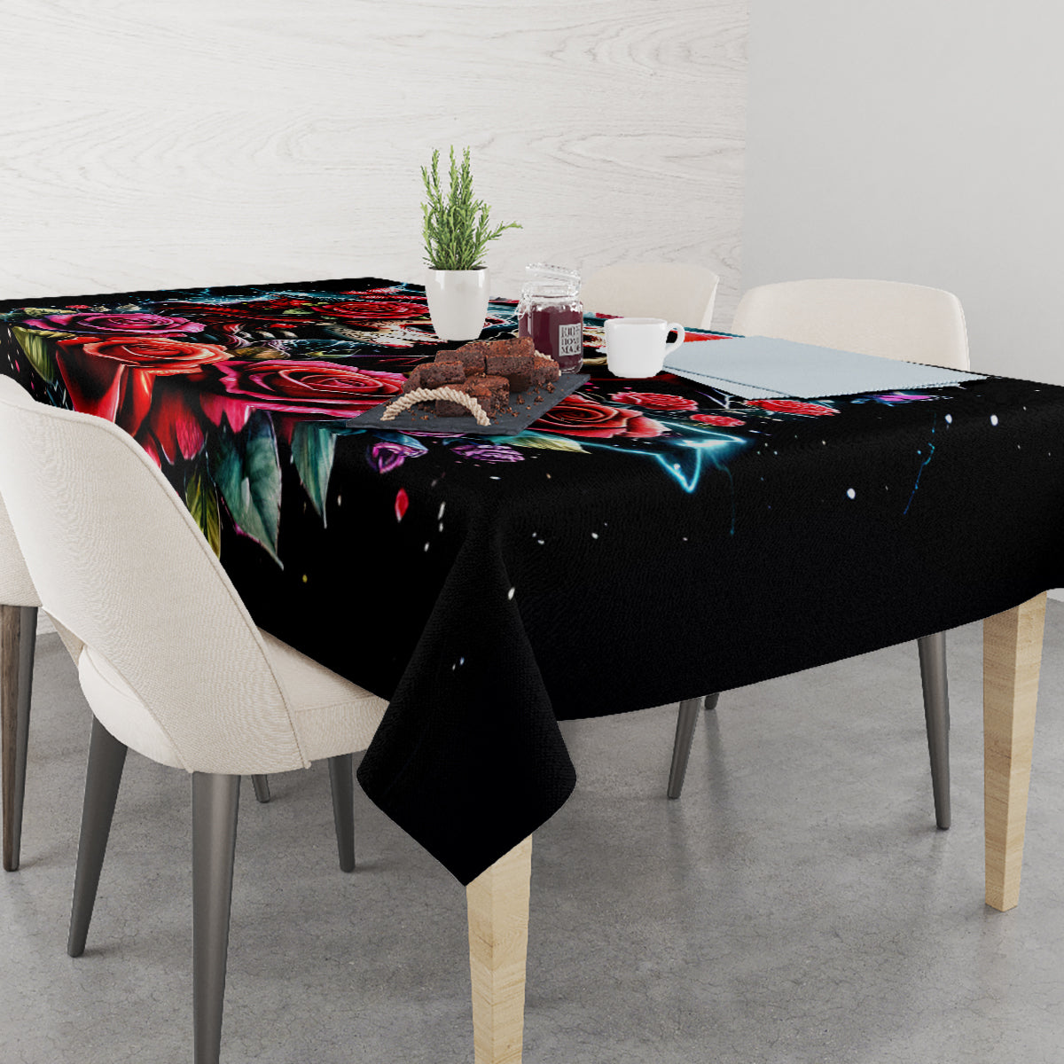 Black tablecloth with colorful skull and rose design on dining table