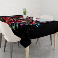 Black tablecloth with colorful skull and rose design on dining table