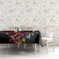 Black tablecloth with skull and rose print on dining table
