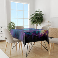 Halloween tablecloth on dining table, purple-blue neon skull pattern with black border