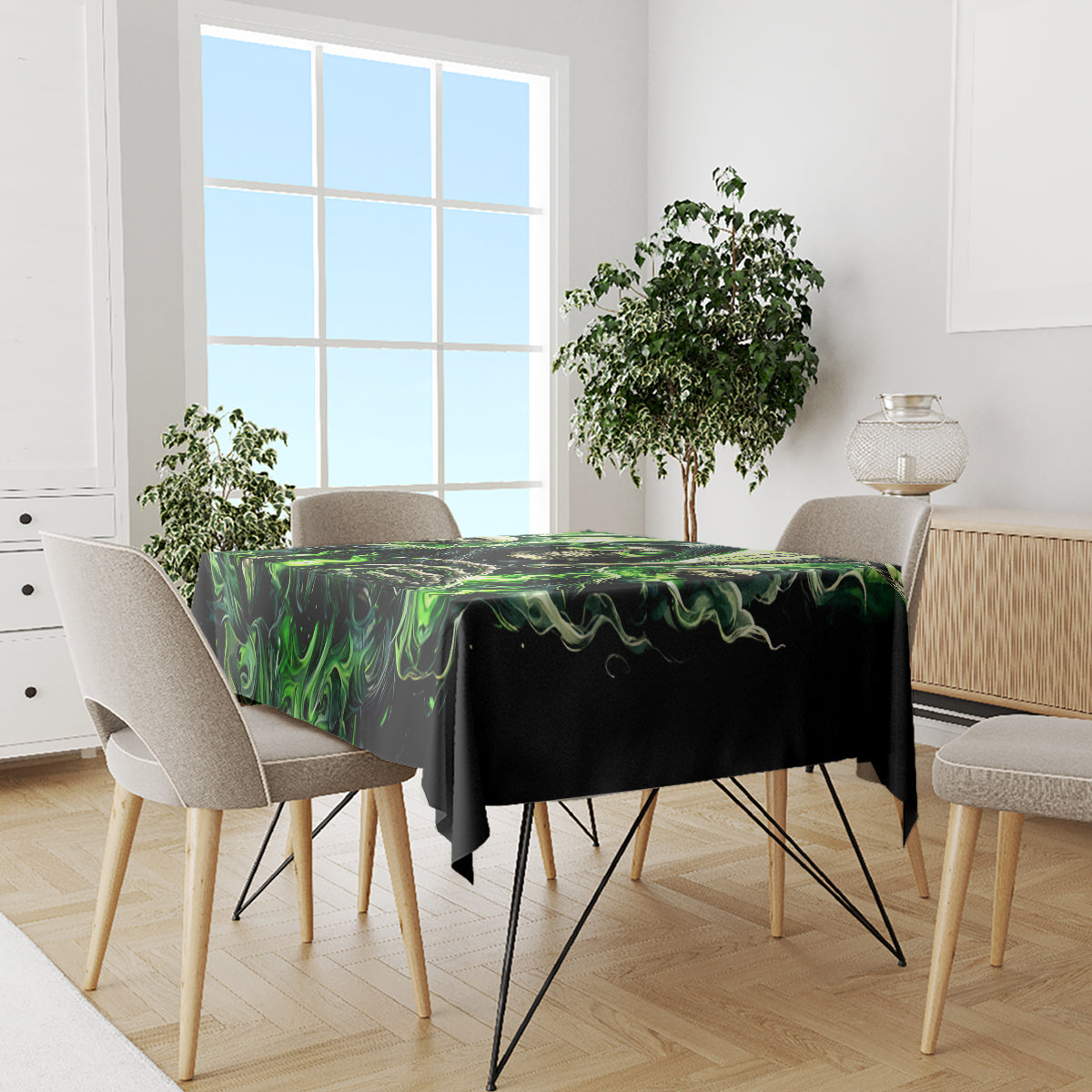 Black skull tablecloth with green flame motif, draped across dining table