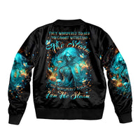 Black bomber jacket with teal witch graphic on back and black ribbed cuffs
