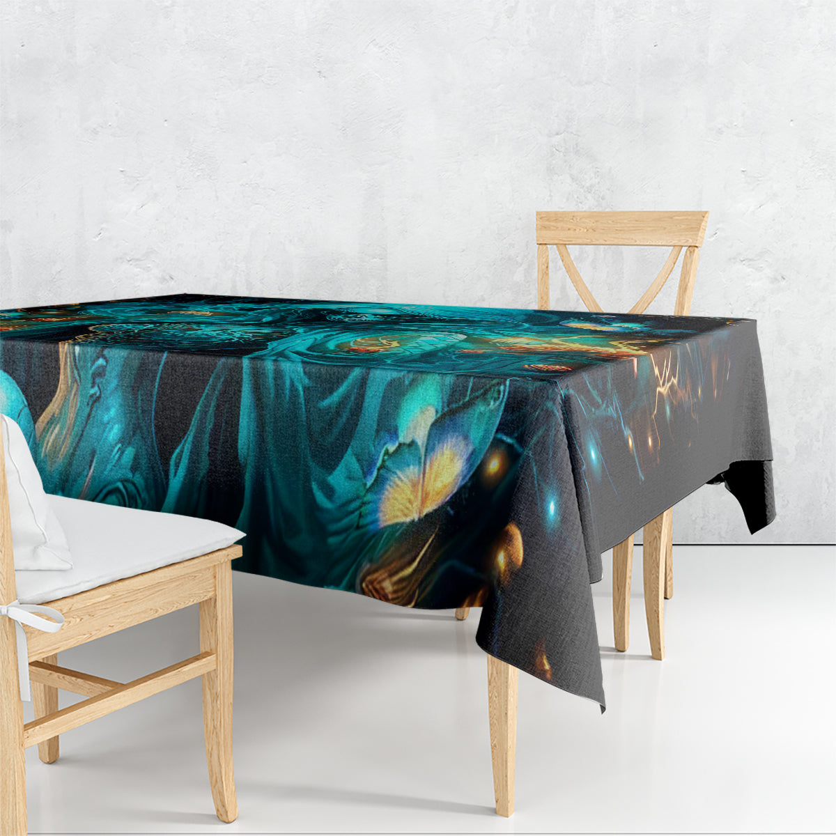 Black tablecloth draped over dining table, teal skull artwork with glowing accents