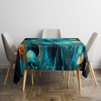 Black tablecloth featuring teal skull and lantern-like flames, laid flat on dining table