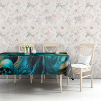 Black tablecloth with teal skull pattern and flame accents, set on dining table