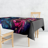 Black tablecloth with vibrant skull-and-rose print, draped over dining table