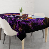 Purple and black skull tablecloth on a dining table with a decorative centerpiece