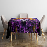 Purple and black skull tablecloth covering a small dining table with chairs