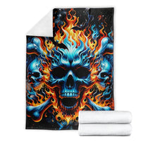 Folded flame skull blanket with matching white towels, blue skull with orange fire