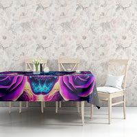 Purple and teal skull tablecloth draped on a table with white chairs