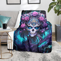 Black skull and rose graphic blanket on chair, blue-purple skull art with pink roses