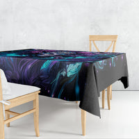 Black tablecloth with teal and purple fantasy wave pattern draped over a dining table