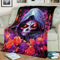 Black skull rose blanket over couch arm and back with glowing accents