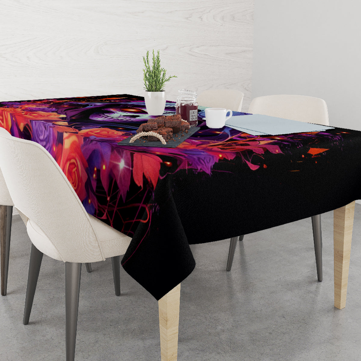 Black gothic tablecloth with skull face and roses, covers dining table and chairs
