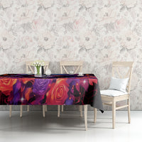 Black skull rose tablecloth on table with vase and cups against floral wall