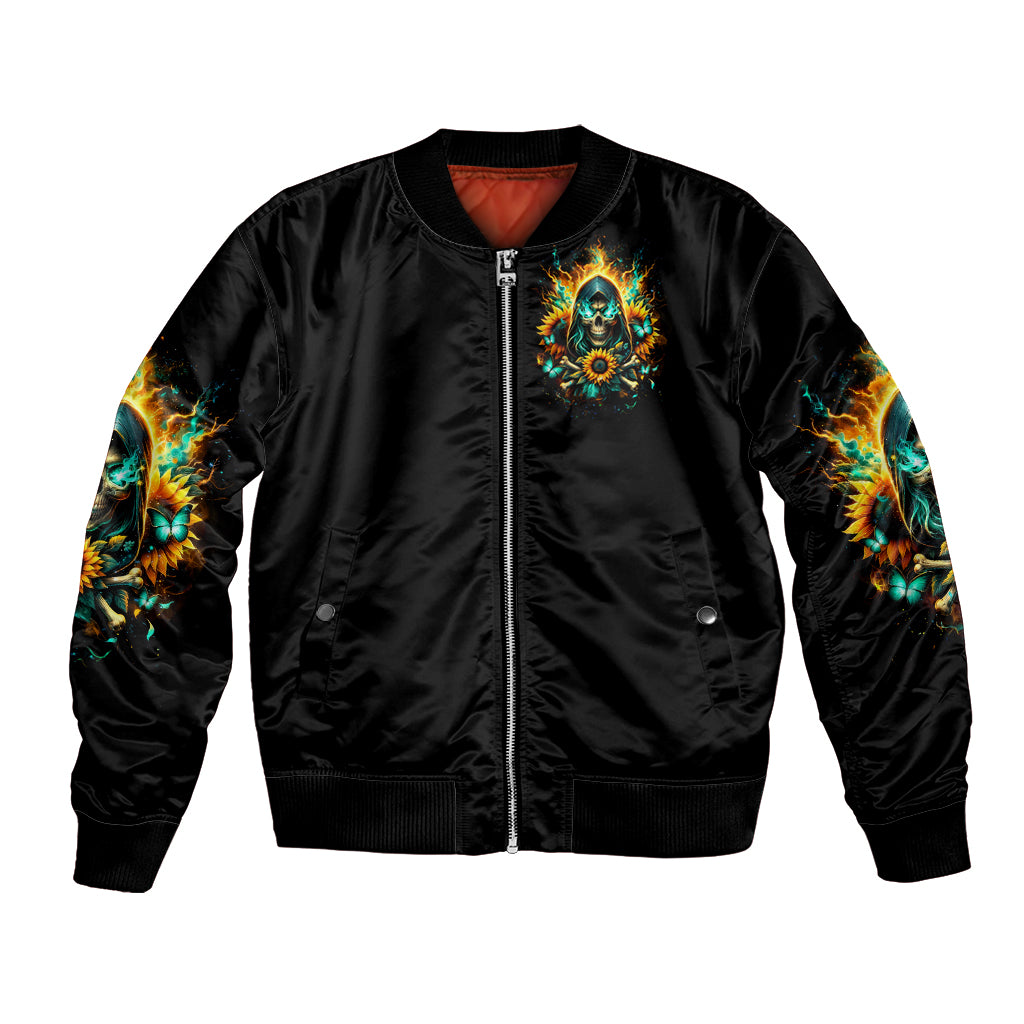 Black bomber jacket with front zipper and teal-gold sunflower skull patch, ribbed hem