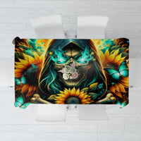 Black tablecloth with skull face, sunflowers, butterflies, and teal accents