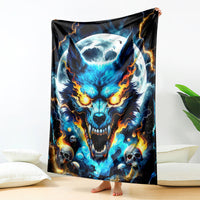 Wolf skull graphic blanket featuring glowing blue wolf face and fiery orange flames