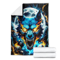 Wolf skull blanket folded with white towels, blue glow and orange flames on black
