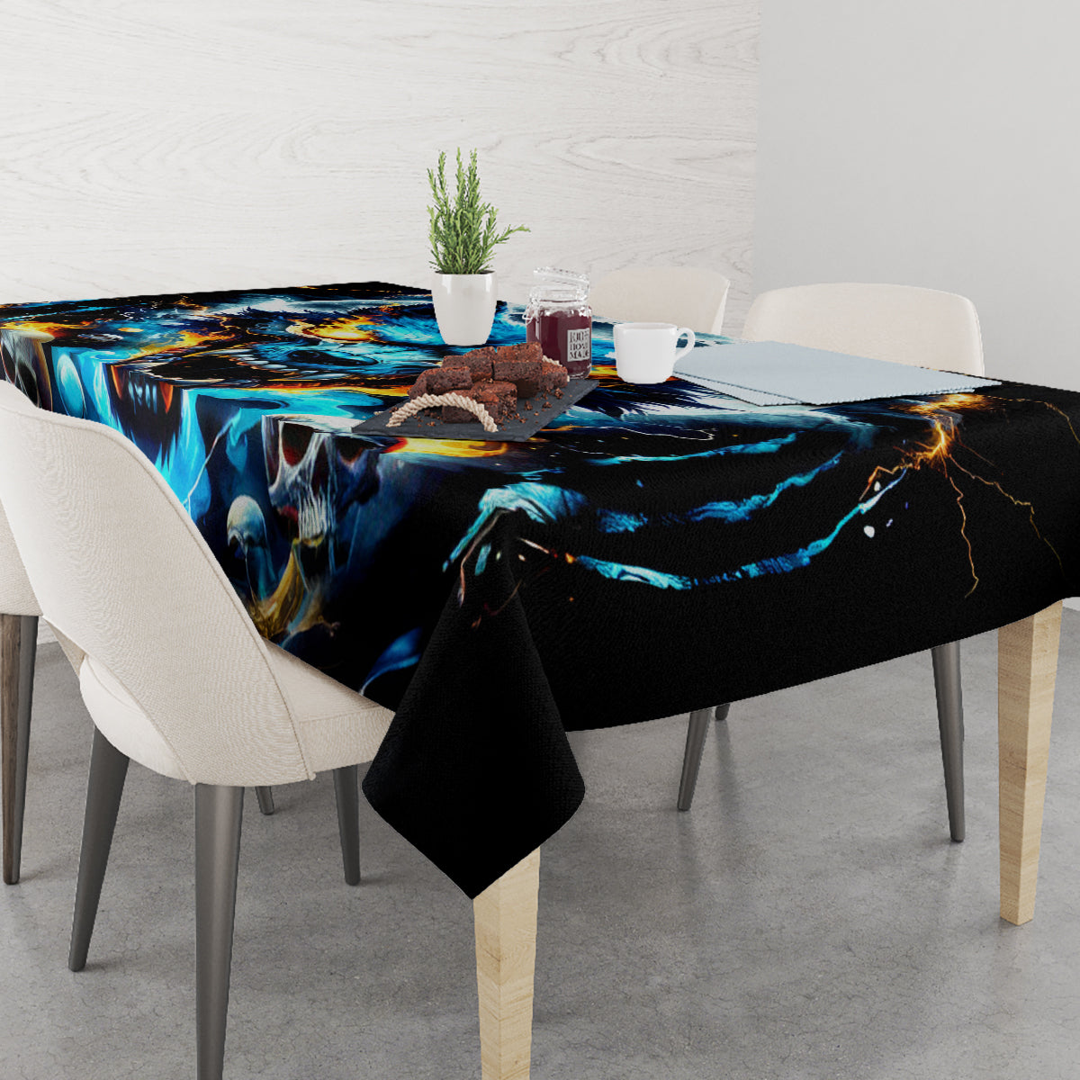 Black tablecloth on dining table with bold blue wolf skull print and drape