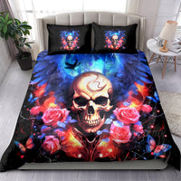 Skull bedding set on bed with two black accent pillows, blue lightning and rose graphics