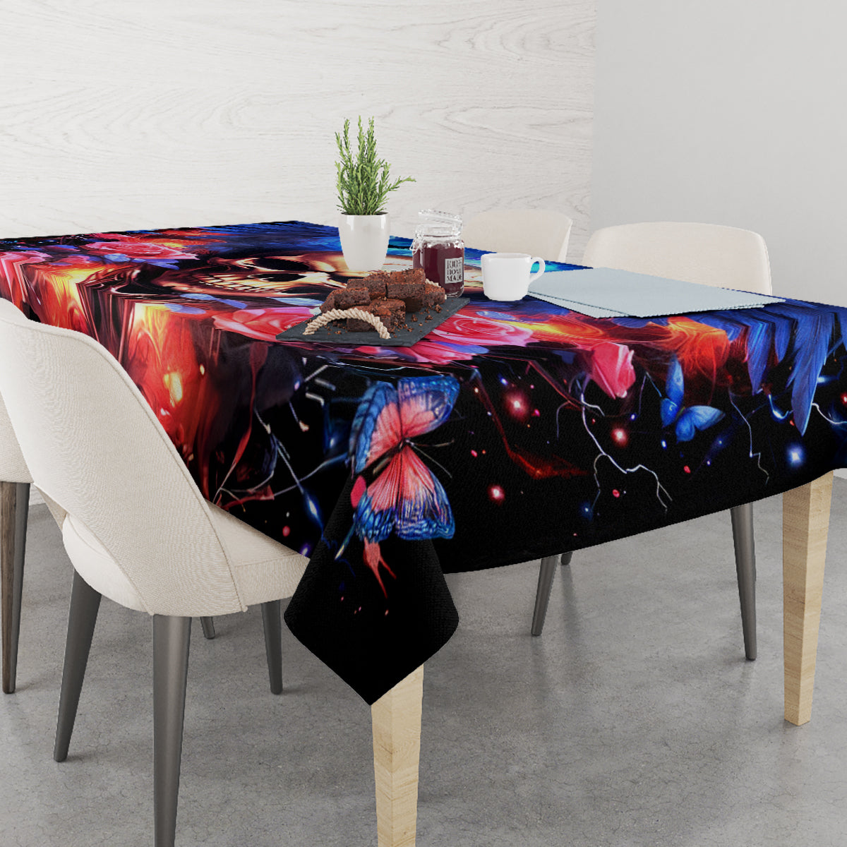 Fairy skull tablecloth in black with red, blue, and butterfly details across tabletop
