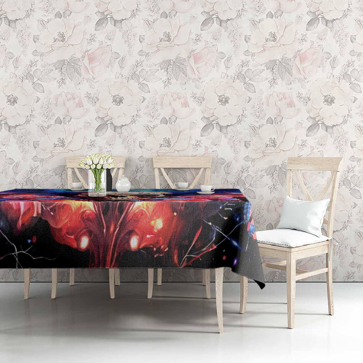 Black fairy skull tablecloth with red and blue graphic, paired with white chairs