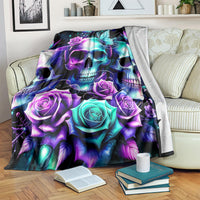 Black skull and rose graphic blanket with teal and purple glowing accents