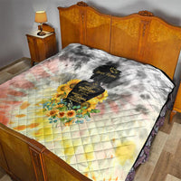 Quilt blanket with diamond stitching, floral bouquet graphic over pastel peach-yellow background