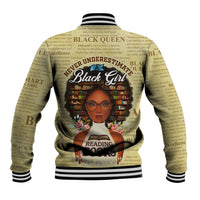 Tan baseball jacket back print with 'Never Underestimate' and Black Girl reading graphic