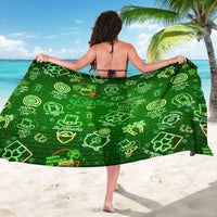 Neon green St. Patrick's Day sarong with clover icons, worn around the waist