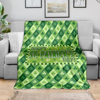 Green St. Patrick's Day blanket draped on a sofa, featuring shamrock diamond pattern