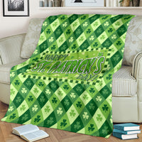 Green St. Patrick's Day blanket close-up with Happy St. Patrick's Day shamrock design