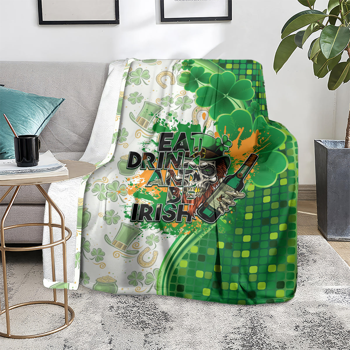 Green and white blanket with clovers and Eat Drink and Be Irish lettering