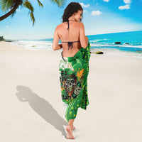 Green patterned sarong (white border) with shamrock clover and 'Eat Drink ... Irish'
