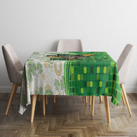 Green and white tablecloth with mosaic and shamrock print on dining table