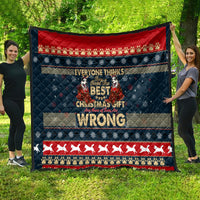 Christmas quilt hanging outdoors, navy and red festive stripes with husky center graphic