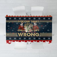 Rectangular navy and red Christmas tablecloth with white dog silhouettes and snowflakes