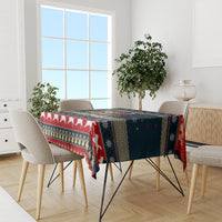 Navy and red Christmas tablecloth on dining table with white dog silhouettes