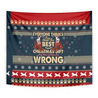 Close-up Christmas tapestry wall hanging with red border, husky silhouettes, and “WRONG”