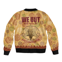 Beige bomber jacket with ribbed hem and cuffs, featuring We Out graphic and Harriet Tubman print