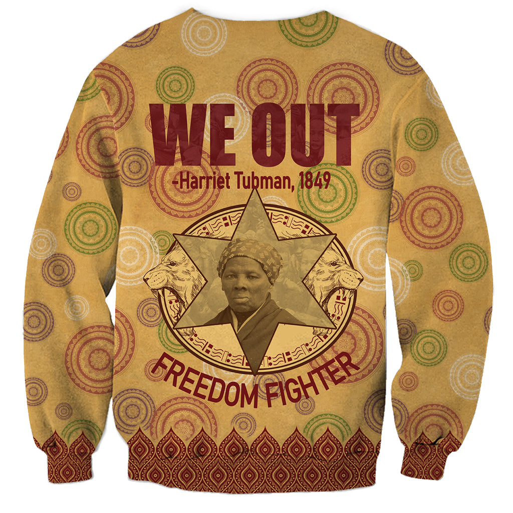 Beige We Out sweatshirt with Freedom Fighter text and colorful circular pattern cuffs hem